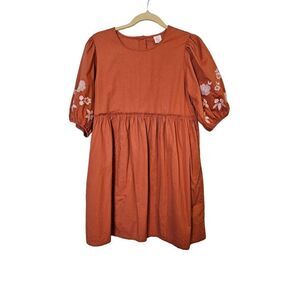 Wonder nation burnt orange short sleeved baby doll dress with embroidered accent